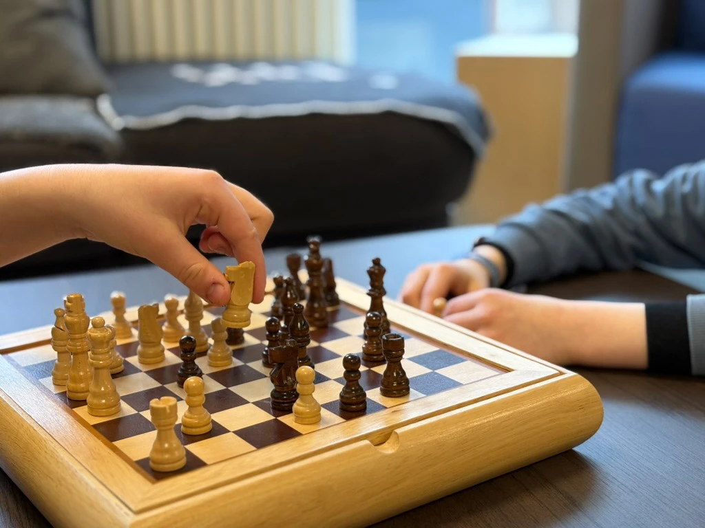 Two children are playing chess