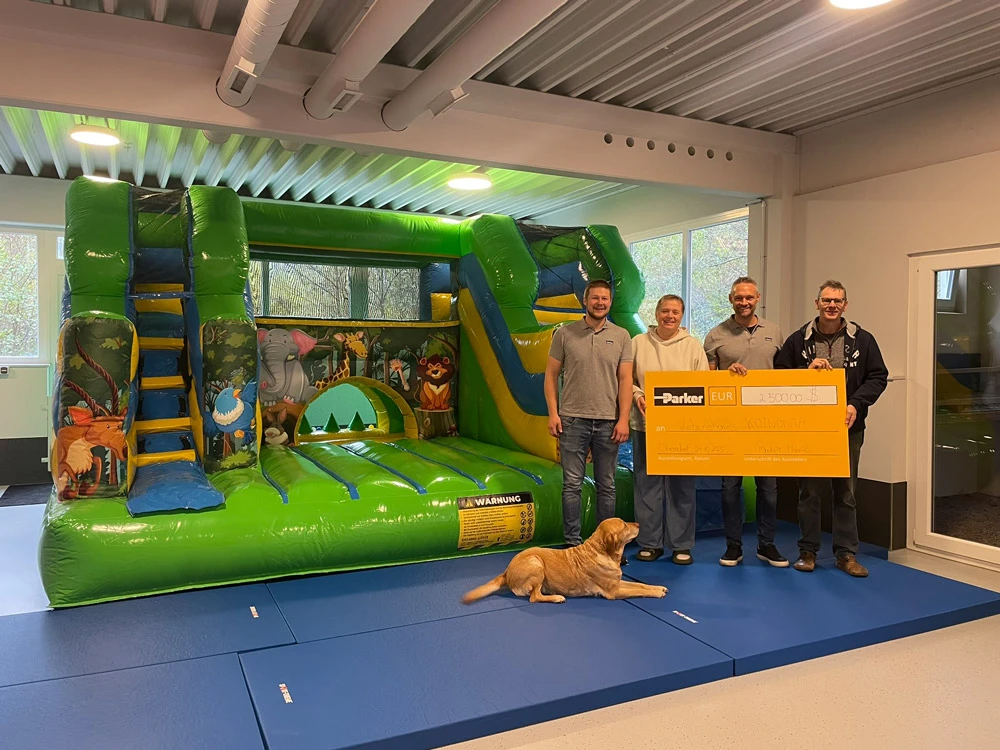 Symbolic check presentation in front of the bouncy castle